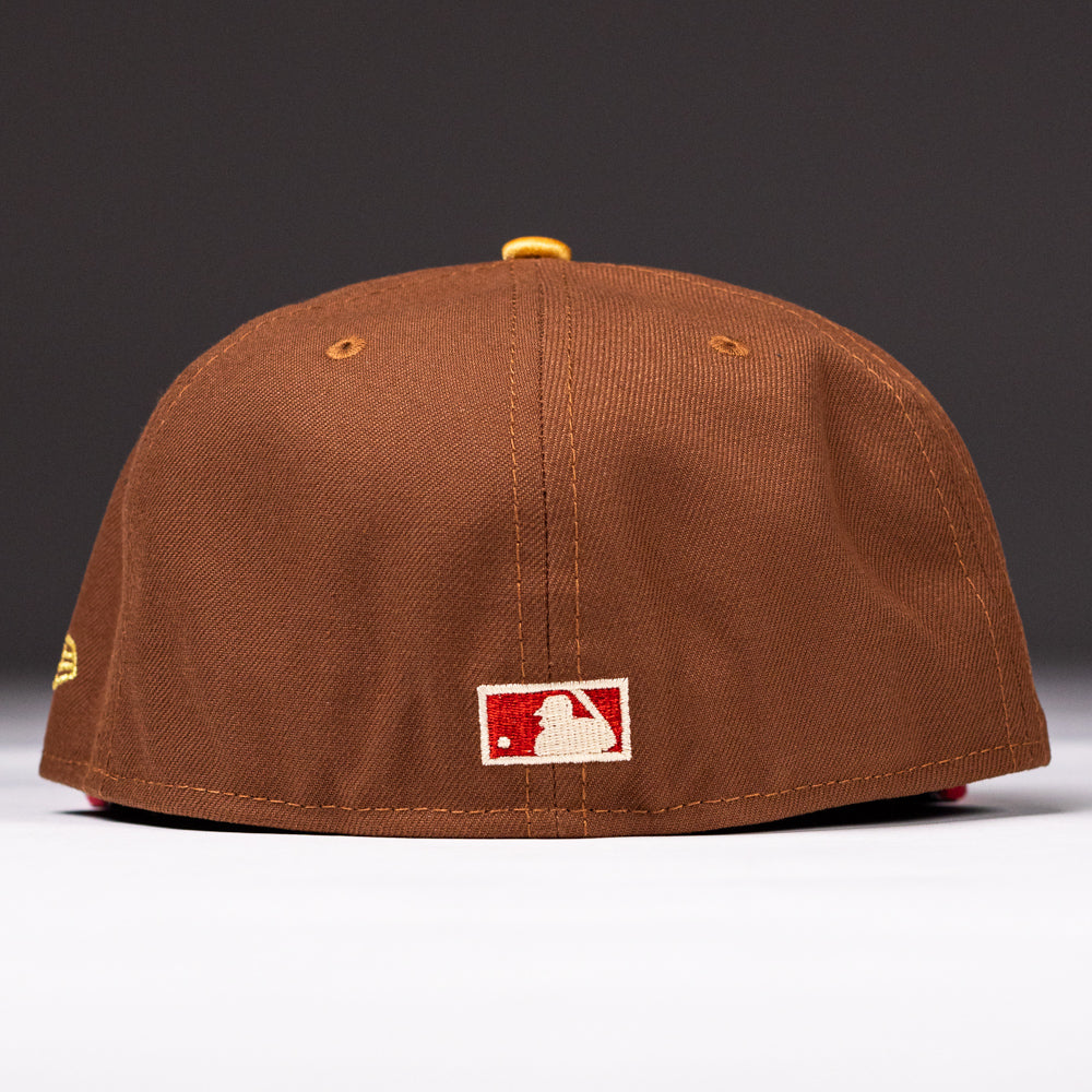 A Bendicion de la Abuela 20th Brown Red Houston Astros New Era Hat 5950 Fitted viewed from the back, featuring the MLB logo patch near the bottom edge of this classic cap.