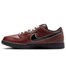 The HJ4131-200 Limosine Dark Pony Black Silver White Nike SB Dunk Low Pro features a brown textured leather upper, white laces, black sole, large black Nike Swoosh, and signature skateboarding details near the heel.