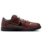 The HJ4131-200 Limosine Dark Pony Black Silver White Nike SB Dunk Low Pro skateboarding shoe features brown textured leather, a black Nike swoosh, white laces, black sole, and black accents on the heel and tongue, shown on a white background.