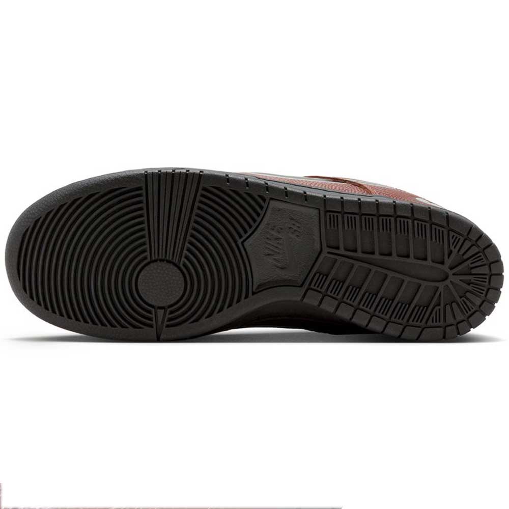 The image shows the black rubber outsole of the HJ4131-200 Limosine Dark Pony Black Silver White Nike SB Dunk Low Pro Skateboarding Shoes, featuring a circular tread at the forefoot, linear grooves, and an embossed Nike logo at the midfoot.
