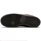 The image shows the black rubber outsole of the HJ4131-200 Limosine Dark Pony Black Silver White Nike SB Dunk Low Pro Skateboarding Shoes, featuring a circular tread at the forefoot, linear grooves, and an embossed Nike logo at the midfoot.