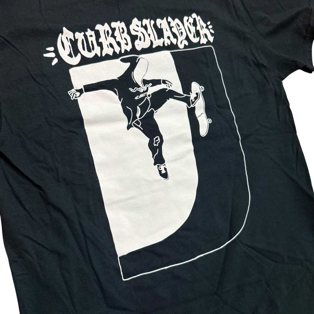 The Logo Black Tee Curbslayer features a striking graphic of a hooded skateboarder landing a trick on a curb—a must-have for true skate fans.