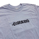 A light purple Curbslayer t-shirt featuring bold black Gothic-style lettering on the chest, inspired by the Logo Light Blue Tee Curbslayer.