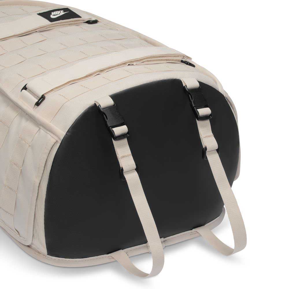 The Lt Orewood Brown Black FD7544104 Nike SB RPM Skate Backpack features a beige and black design with a black Nike logo, beige straps, black buckles, front zipper pocket, and dedicated laptop compartment.