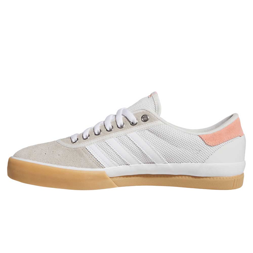 The Adidas Lucas Premiere White Coral HQ7524 skateboarding shoes feature suede details, white laces, three classic stripes, a tan gum sole, and a light pink heel accent—a stylish update to a skate classic.