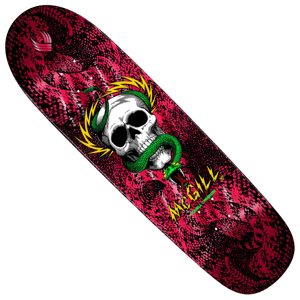 The McGill Skull Pro Flight Deck 8.97x32.3 Red Foil Powell Peralta showcases a white skull with a green snake, yellow MAGILL lettering, and a pink-black textured background—an iconic design with lasting pop for skaters.