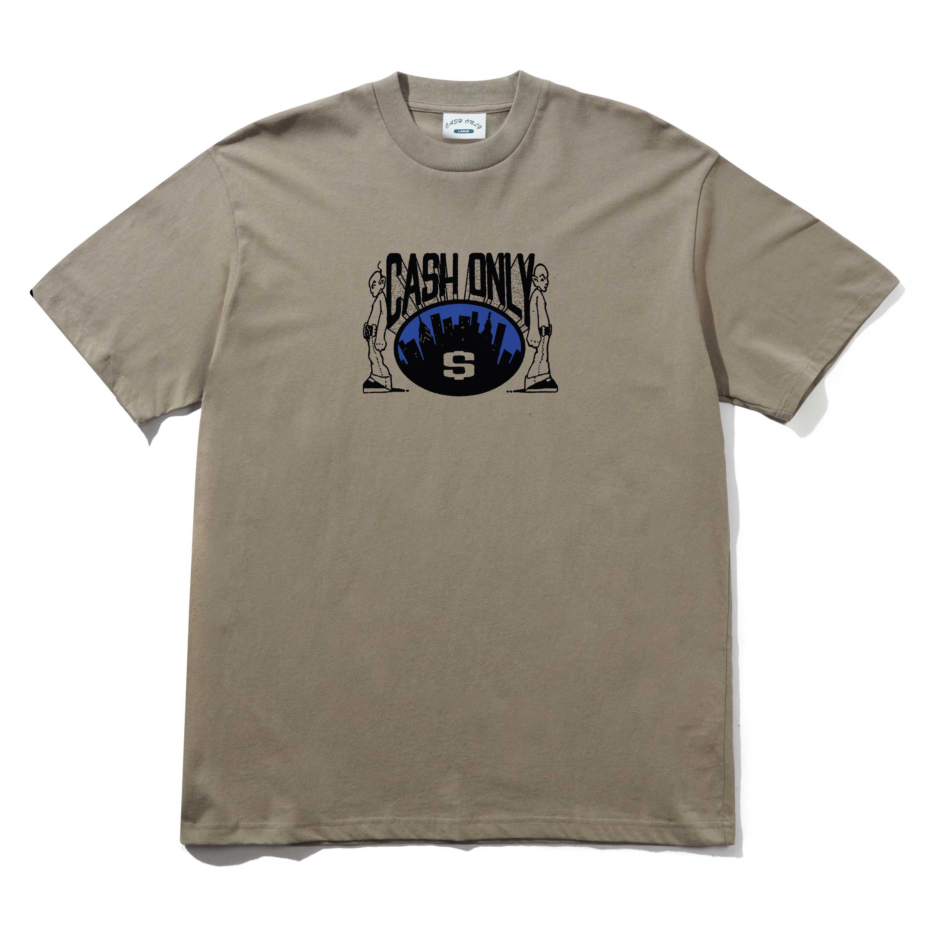 The Metro Tee Stone Cash Only is a beige 6.5oz heavyweight cotton tee with a screenprint of two statues, a city skyline, and "CASH ONLY" above a stylized S logo centered on the front.