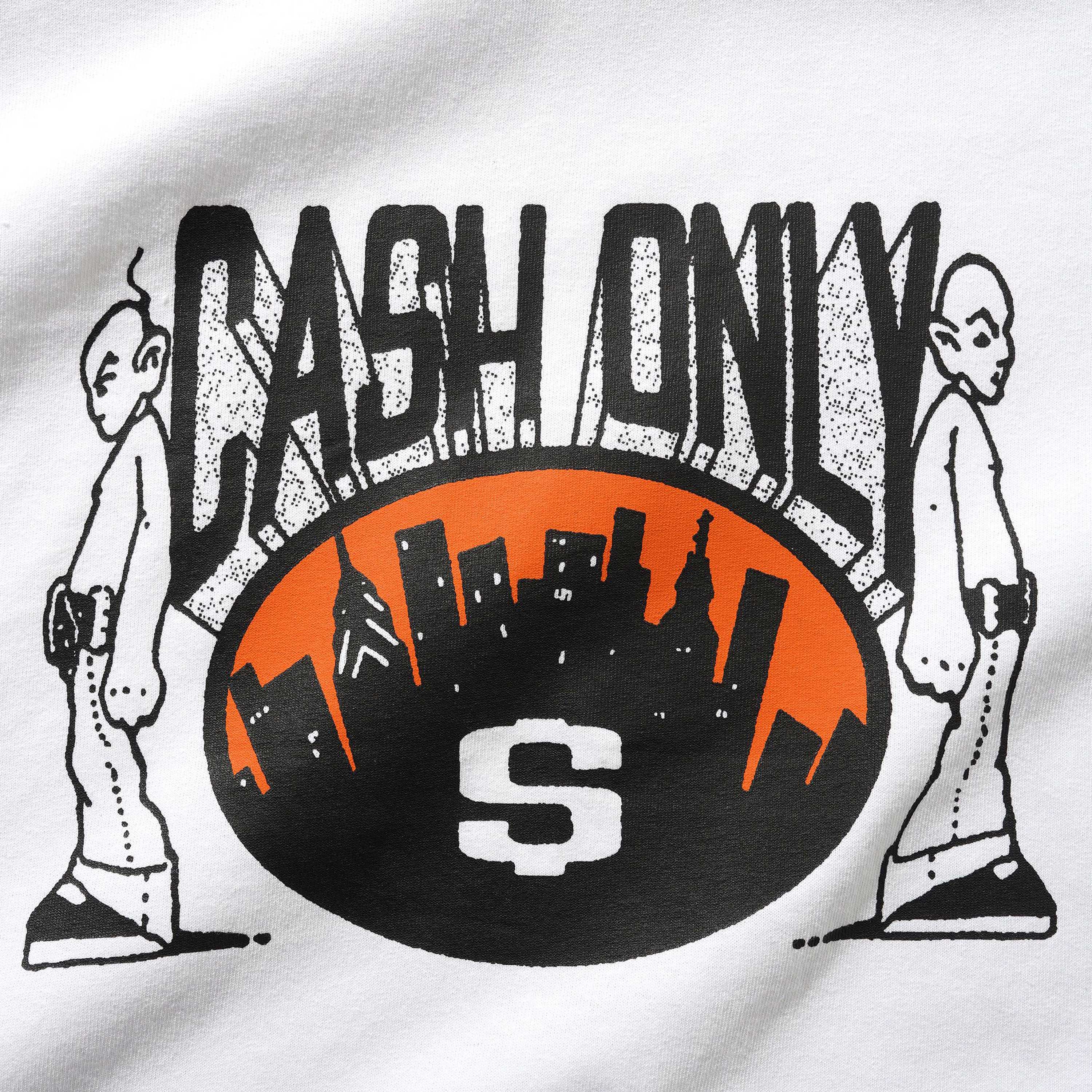 A screenprint graphic for the Metro Tee White Cash Only features "CASH ONLY" above a city skyline in an orange oval, a big white S at the bottom, and two cartoon characters back-to-back on each side.