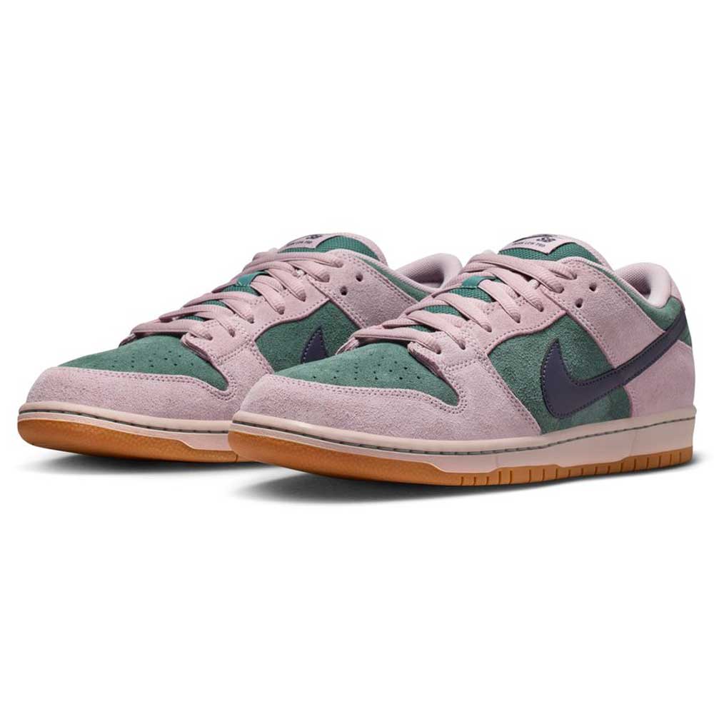The Minereal Slate Dark Raisin Dunk Low Pro HQ1625300 Suede Skateboarding sneakers feature light pink suede overlays, green suede panels, dark blue swooshes, and gum rubber soles, shown at a slight angle on a white background.