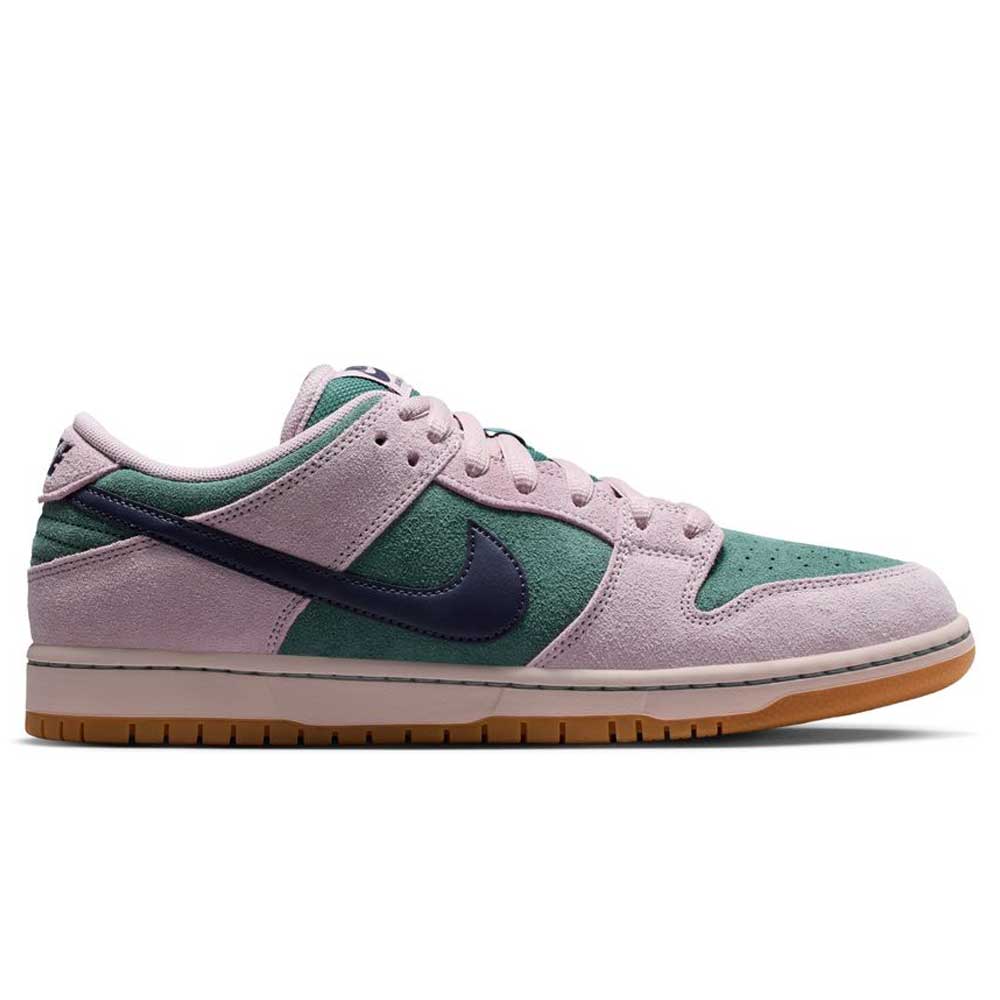 The Minereal Slate Dark Raisin Dunk Low Pro HQ1625300 Suede Skateboarding sneaker features light pink suede overlays, green panels, a navy blue Swoosh, and a gum rubber sole, shown in a side profile against a white background.
