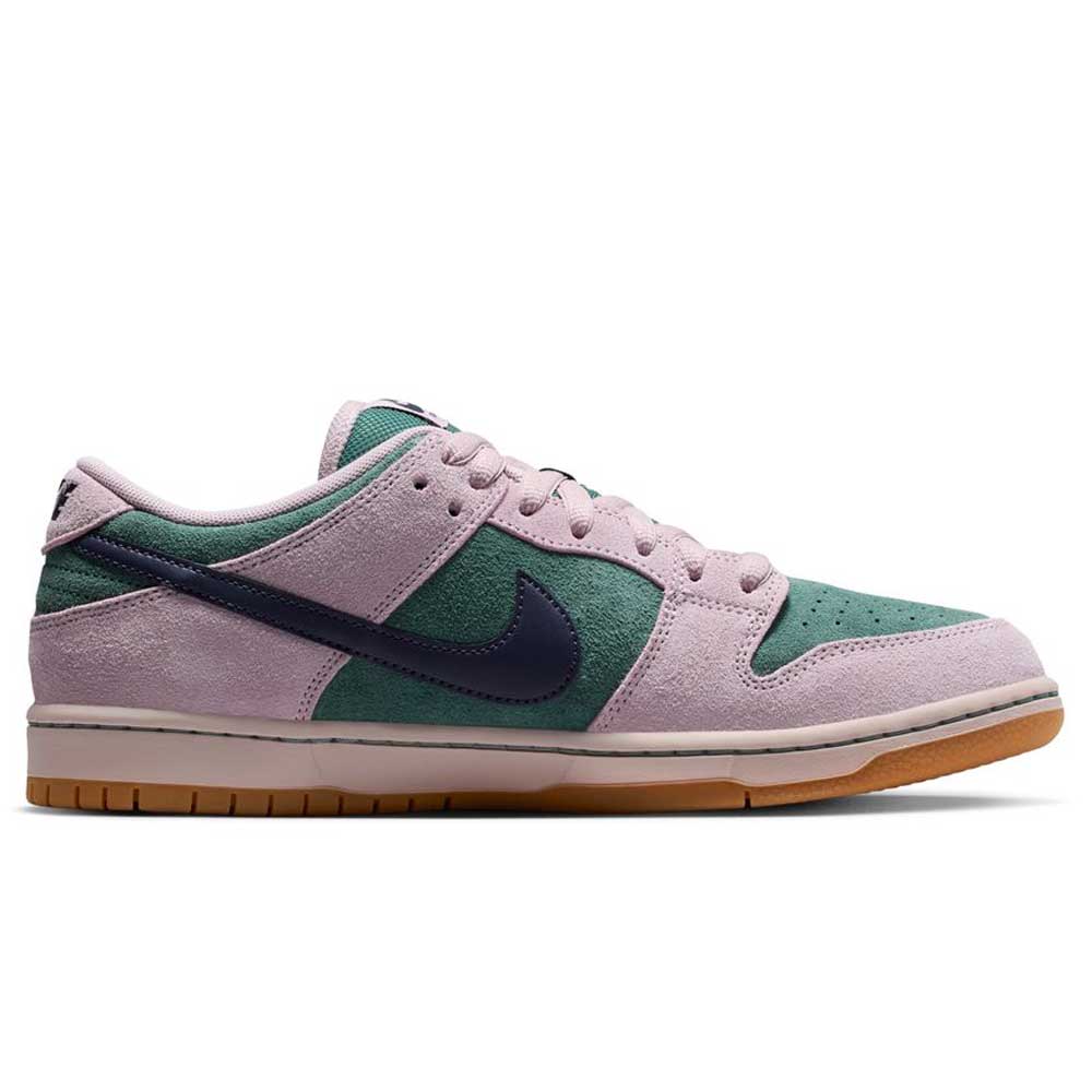 The Minereal Slate Dark Raisin Dunk Low Pro HQ1625300 Suede Skateboarding shoe features pink suede overlays, green mesh panels, a dark blue swoosh, and a light brown gum sole, shown in left profile against a white background.