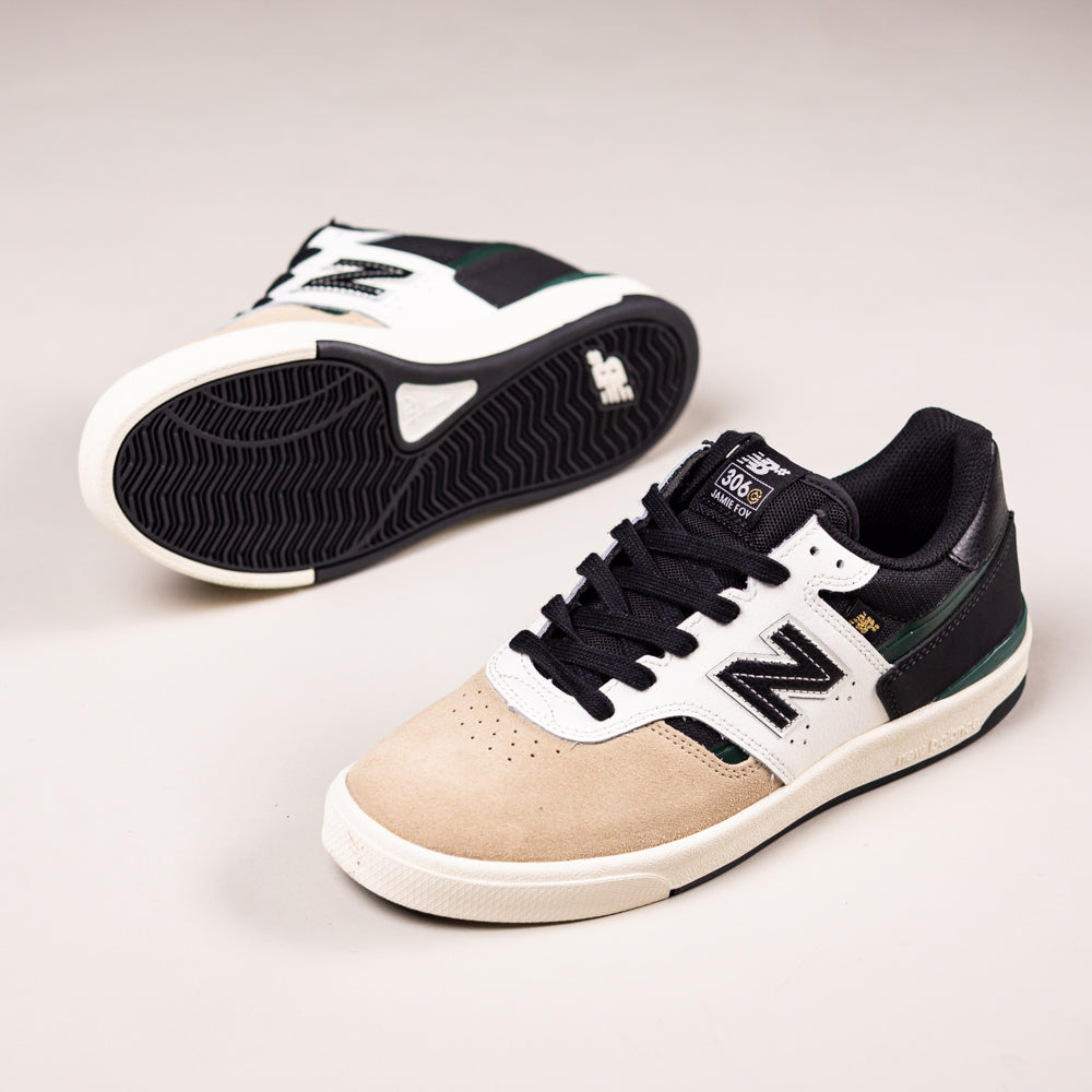 A pair of Incense Black Jamie Foy Cup 306 CBB New Balance Numeric suede skateboarding shoes with beige toes, black laces, white sides, black and green accents, and black soles displayed on a neutral background.