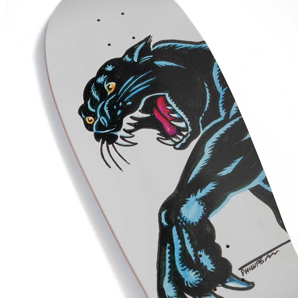 A Santa Cruz Natas Sketch Panther Reissue skateboard deck (10.54in x 30.14in) featuring a bold illustration of a black panther baring its teeth and reaching out its clawed paw against a plain light background.