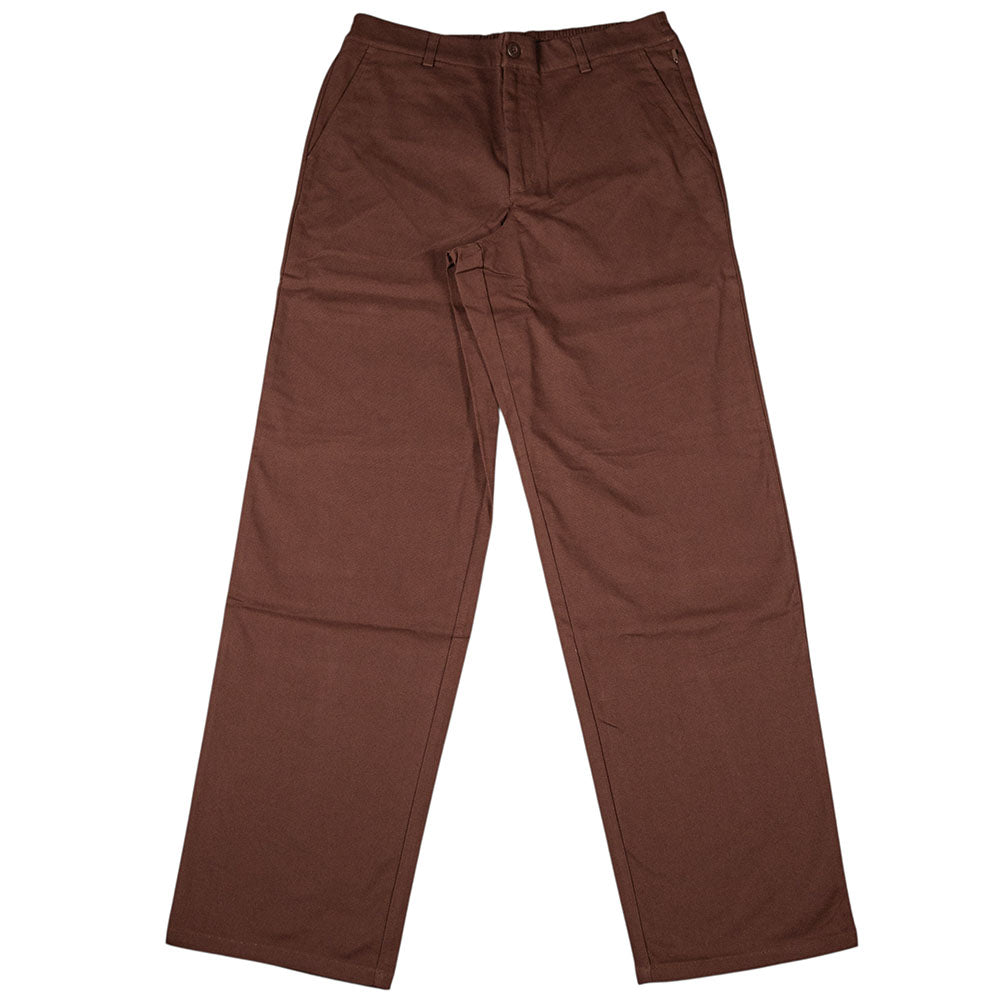 The New Balance Numeric Pant Pumperknickel MP51953ABJ is a pair of brown cotton canvas straight-leg pants with belt loops, button and zipper closure, and front pockets, shown laid flat on a white background.