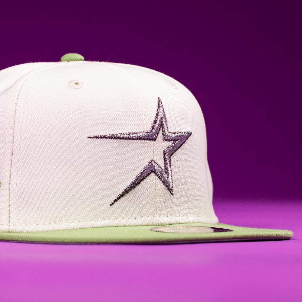 The Matcha Guy Houston Astros 5950 Fitted New Era Hat has a white crown, green brim and button, and features a large silver embroidered star on the front against a solid purple background.