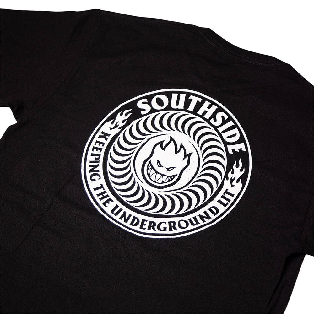 The Southside x Spitfire KTUL Pinwheel Black Tee features a bold circular white design with a flaming, grinning cartoon face at the center—an unmistakable tribute to Spitfire’s legendary style. Surrounding the circle is the text “SOUTHSIDE KEEPING THE UNDERGROUND LIT,” embodying Southside Skatepark’s energy in an Underground Lit Pinwheel motif.