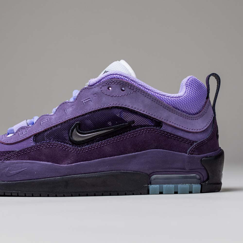 A side view of the Black Noble Purple IR1887500 Air MAX Ishod Nike SB Skateboarding Shoe shows black accents, a black Swoosh, white laces, and visible Max Air cushioning in the heel, set against a plain gray background.