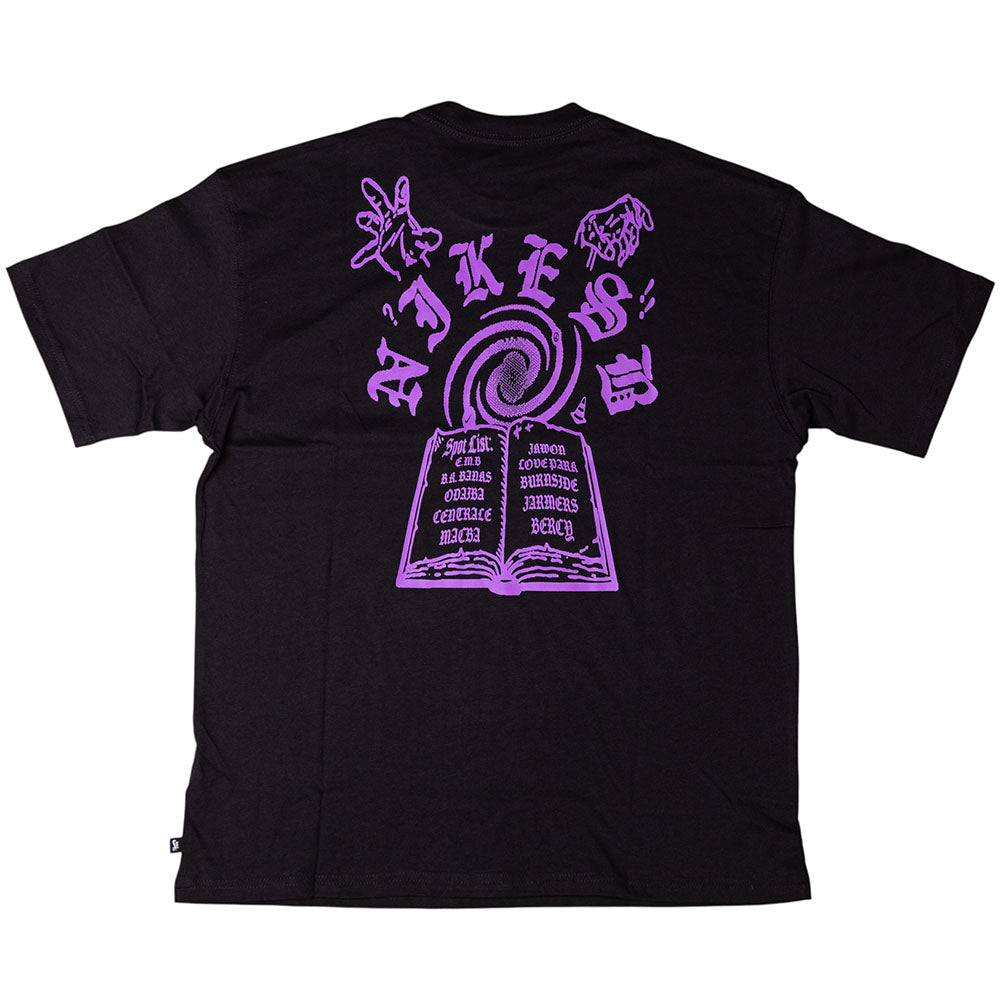 The Purple Black Tee IR6747010 T-Shirt from Nike SB features a large purple skateboarding graphic on the back with mystical symbols and text. Crafted from midweight cotton, it offers durable comfort and a roomy fit for daily wear.
