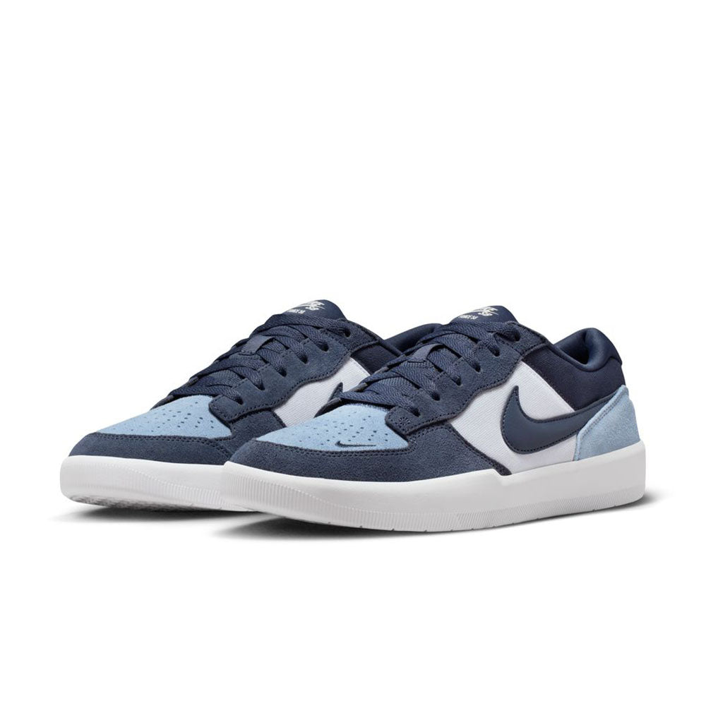 A pair of Nike SB Force 58 suede skateboarding shoes in Light Armory Blue, Thunder, and Photon Dust (DV5477-404) with navy and light blue panels plus dark blue swooshes—blending basketball and skate style on a clean white background.