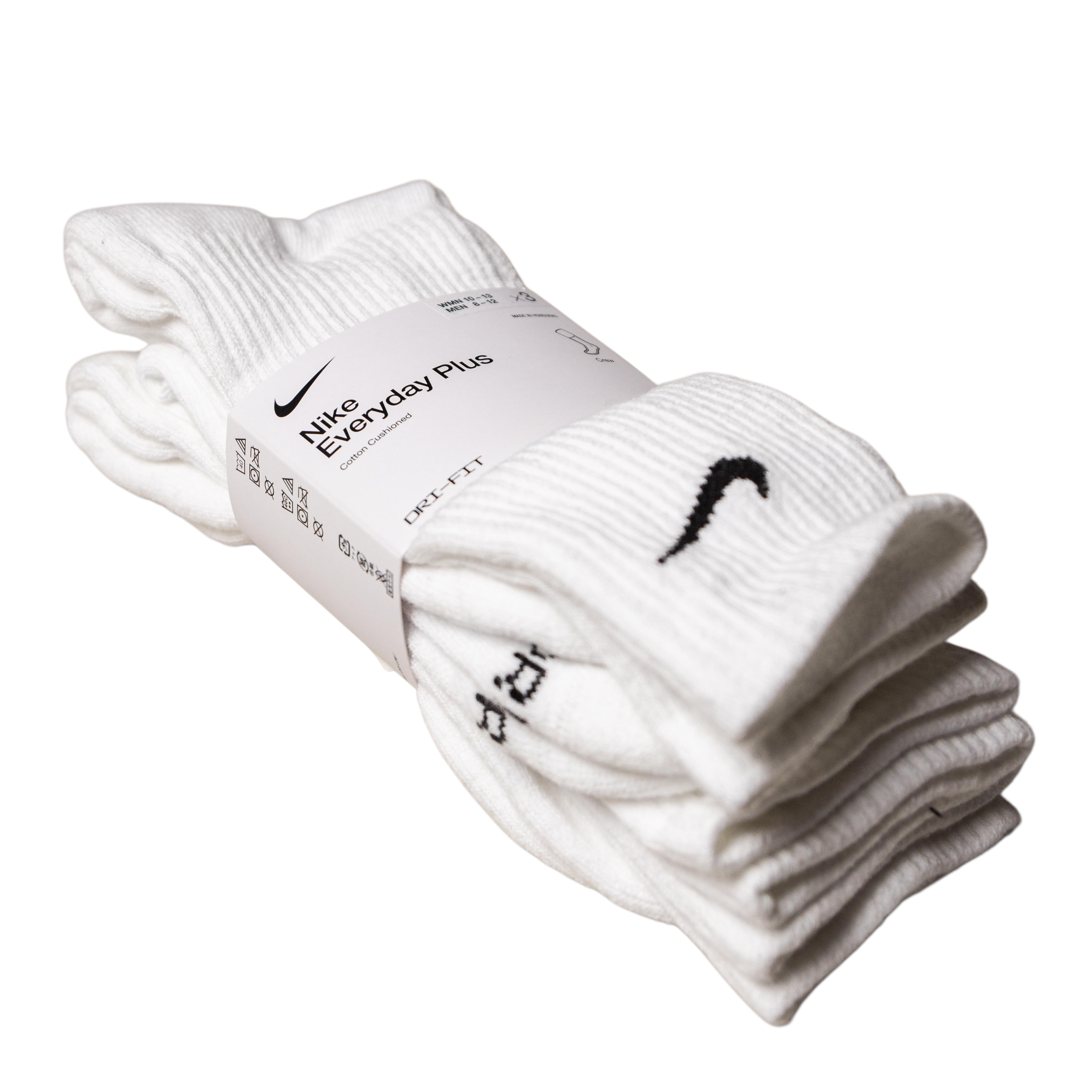 A 3-pack of white Nike SB Crew Socks with Dri-FIT technology, stacked with a white label showing the Nike logo and product info. Each sock features a small black Nike Swoosh near the top.