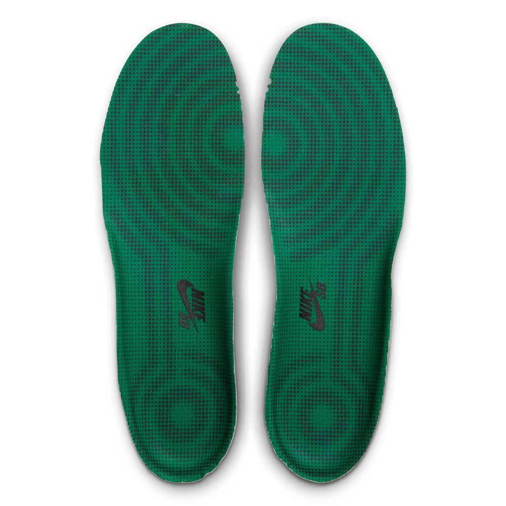 Pair of green AF1 Cool Grey Court Green Black IV5289003 Nike SB Suede Skateboarding Shoes insoles featuring a black circular grid pattern and a black logo on the heel.