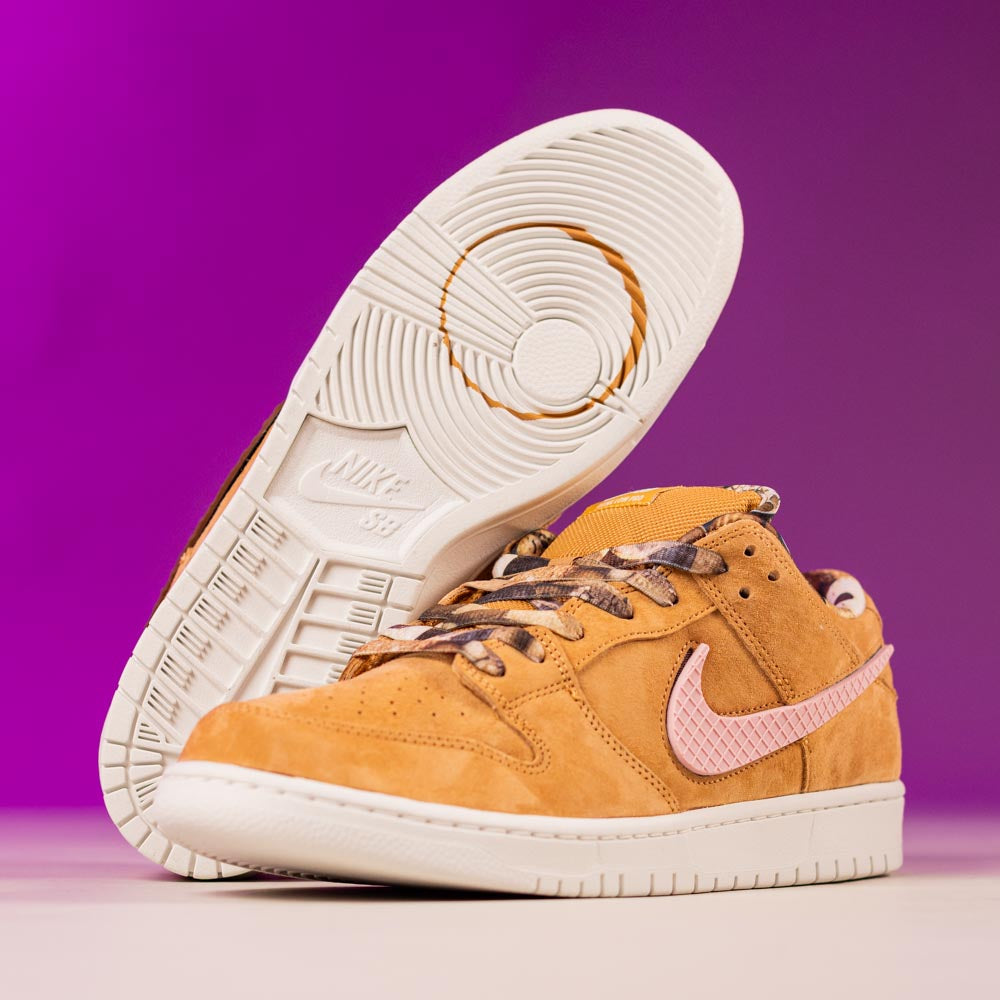 The READ BELOW the BUTTON RAFFLE Nike SB Brew and Biscuits Dunk Low features tan uppers, textured pink swooshes, brown laces, and white soles—ideal for your next Southside Skatepark raffle entry.