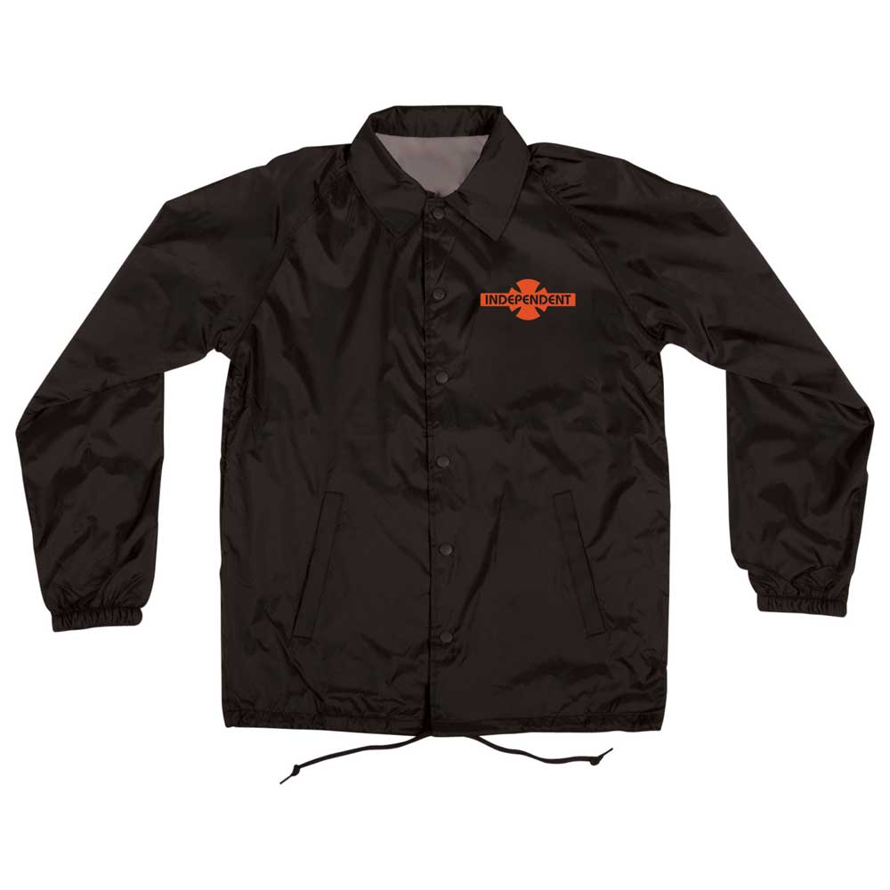 The OGBC Legacy Coach Windbreaker Longsleeve Jacket Black Red by Independent features a collar, elastic cuffs, drawstring hem, and orange-black Legacy cross logo on the chest—ideal as a classic skateboarding jacket for men.