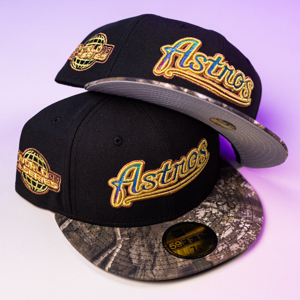 Two Oil Spill WS05 Houston Astros New Era 5950 Fitted hats in black with gold embroidered logos, world patches, patterned gray and black brims, and gold 5950 Fitted size stickers on the visors.