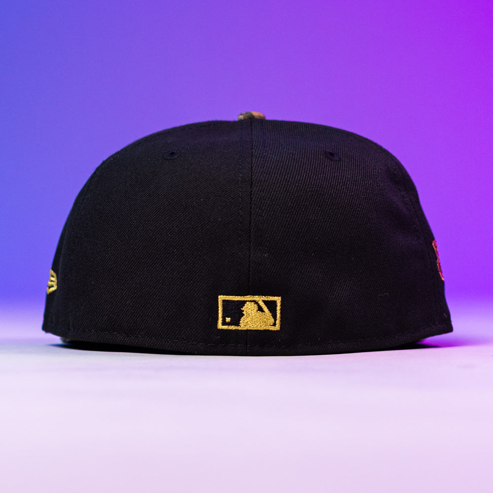 The Oil Spill WS05 Houston Astros 5950 Fitted New Era Hat in black, shown from the back with a gold MLB logo above the edge, is set against a purple gradient background.