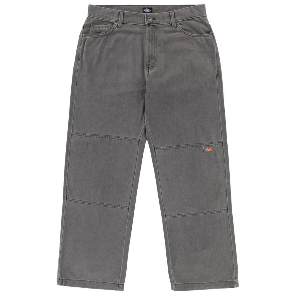 The P415259 Loose Double Knee Woven Denim Jean in Grey Wash by Dickies Skateboarding offers relaxed, straight-leg durability with horizontal knee stitching, front pockets, belt loops, and a small red logo patch on the upper left thigh.