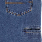 Close-up of the P415316 Mike Anderson Stonewashed Denim Jean by Dickies Skateboarding, featuring blue denim with a back pocket outlined in orange stitching and a horizontal slit pocket with matching detail.