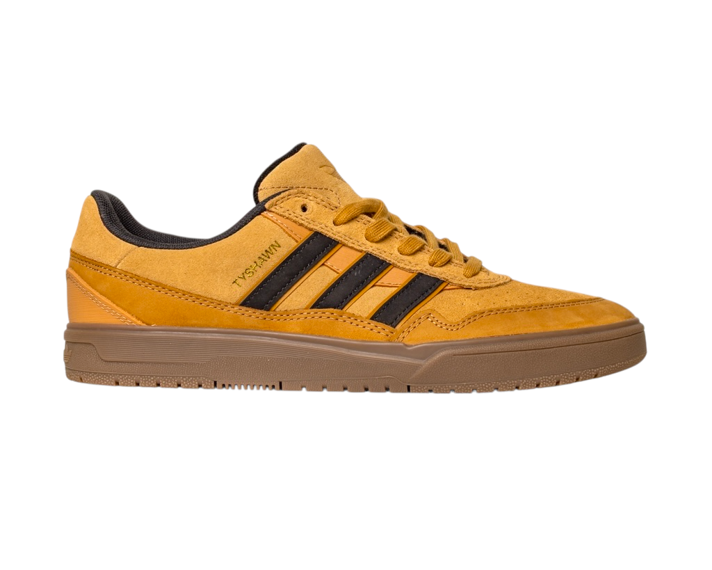 The JI0851 Mesa Black Gum Tyshawn 2 Adidas Leather Suede Skateboarding Shoe is shown in side profile, featuring mustard yellow suede with black stripes, a brown outsole, and cupsole construction on a white background.