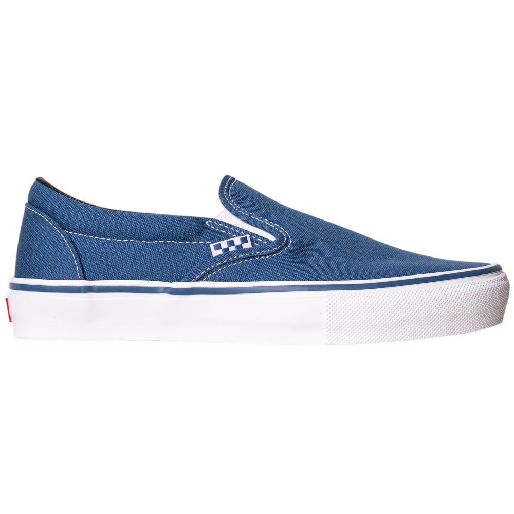 The VN0A5FCANVY1 Navy Skate Slip On Vans Canvas Shoes feature blue canvas, white stitching, a white rubber sole, DURACAP reinforcement, and a checkerboard accent near the elastic side panel. Shown in side profile on a plain white background.