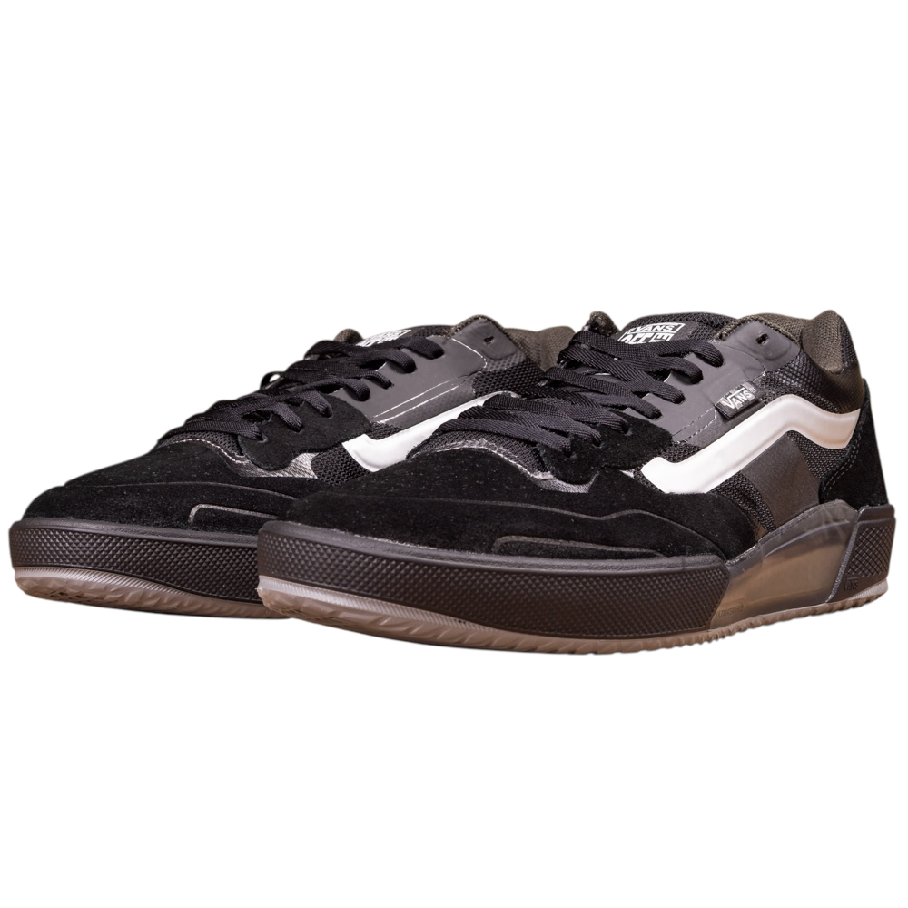 The VN000DA1B5T1 Black Metallic Skate Ave 2.0 Vans Suede Skateboarding Shoes feature black low-tops with white side stripes, black laces, textured soles, and a suede-mesh mix for high-performance skateboarding.