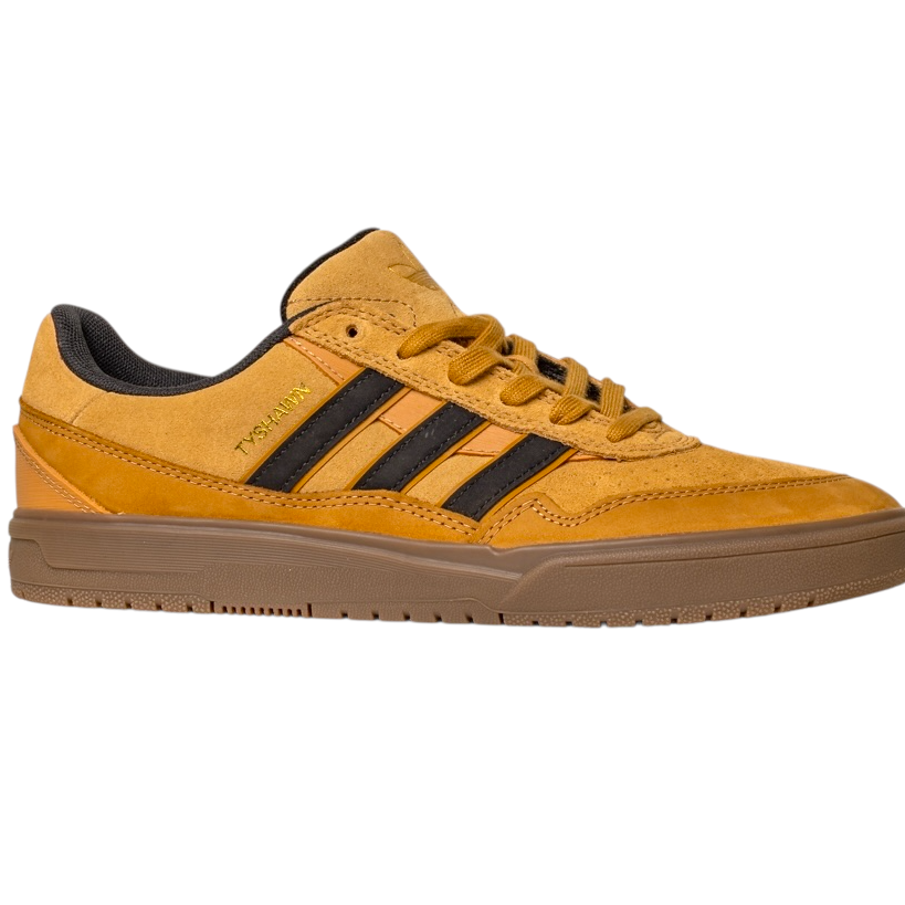 The JI0851 Mesa Black Gum Tyshawn 2 Adidas skateboarding shoes feature mustard yellow suede, black stripes, a gum sole, gold TONAL text on the side, and cupsole construction inspired by the Tyshawn II. Side view shown on white background.
