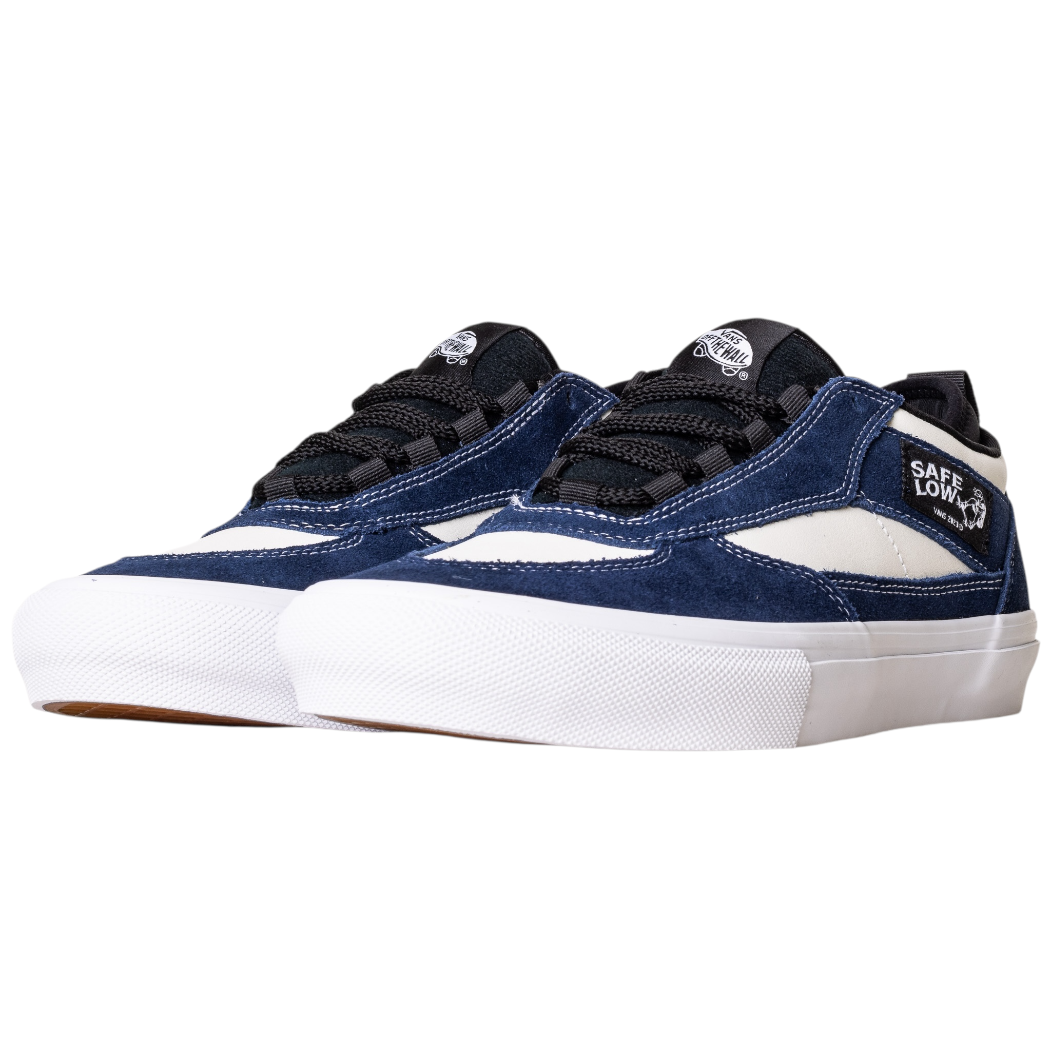 The VN000EEHFRP Skate Safe Low Navy Marshmallow features navy suede, white leather accents, black laces, white midsoles, and Safe Low branding near the ankle, combining Vans skate durability and impact protection.