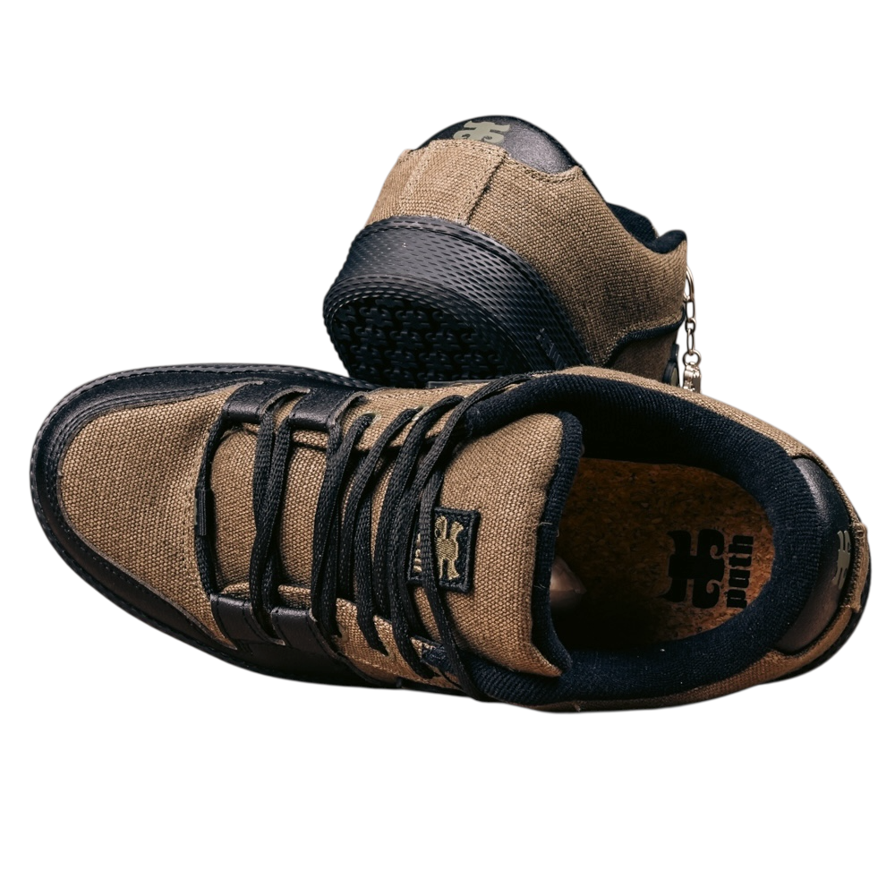 The Cricket Green Waxed Hemp I Path Shoes for skateboarding feature green waxed hemp uppers, black laces, rubber soles, and cork insoles, shown on a white background—one upright, the other on its side.