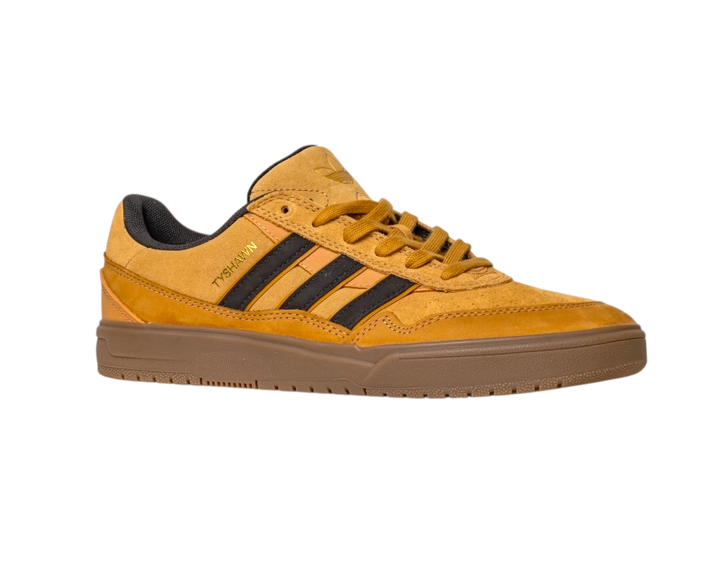 The JI0851 Mesa Black Gum Tyshawn 2 Adidas skateboarding shoes feature a tan and brown leather-suede upper, black stripes, gold TYSHWN text, cushioned collar, cupsole construction, and gum sole on a white background.