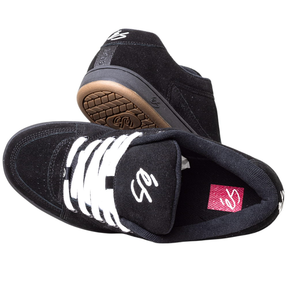 A pair of Accel Black Noir Es Shoes Skateboarding Original Shape, featuring white laces, a white tongue logo, and a brown patterned cupsole—true to the classic 1995 skate shoe design.