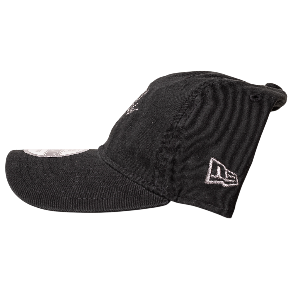 The Southside Pewter Script Strapback 920 Hat by New Era is a black cap shown in profile, featuring a white embroidered side logo, curved brim, visible stitching, and is photographed on a white background.