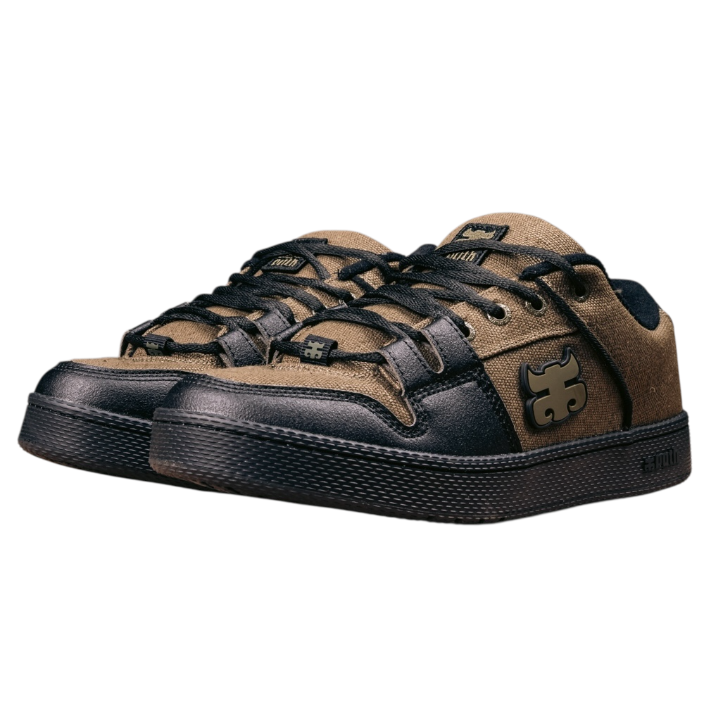 The Cricket Green Waxed Hemp I Path Shoes are low-top skate shoes with black soles, black and brown synthetic uppers, laces, and a bold stylized logo on the sides and toe area.
