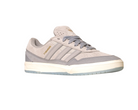 The JI0848 Granite White Tyshawn 2 II Adidas Skateboarding Shoe features gray and beige suede, three side stripes, a white midsole, TYSHAWN in gold, a light blue outsole, and is part of the Tyshawn II collection.