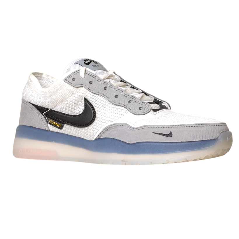 The FV8493-004 Grey White PS8 Nike SB Leather Knit Shoe features a black Swoosh, blue midsole, translucent outsole, and Air Zoom cushioning, plus an Air Zoom label near the heel, shown on a white background.