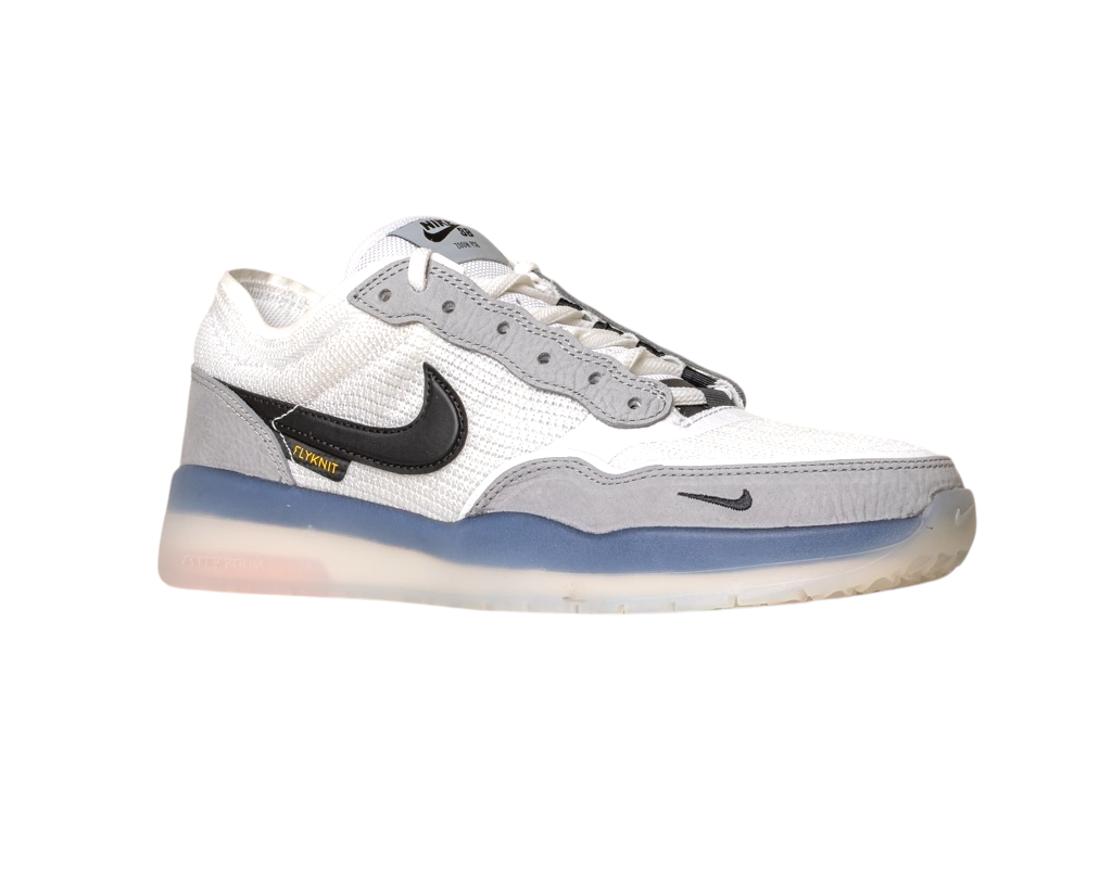 The FV8493-004 Grey White PS8 Nike SB Leather Knit Shoe features a black Swoosh, blue midsole, translucent outsole, and Air Zoom cushioning, plus an Air Zoom label near the heel, shown on a white background.