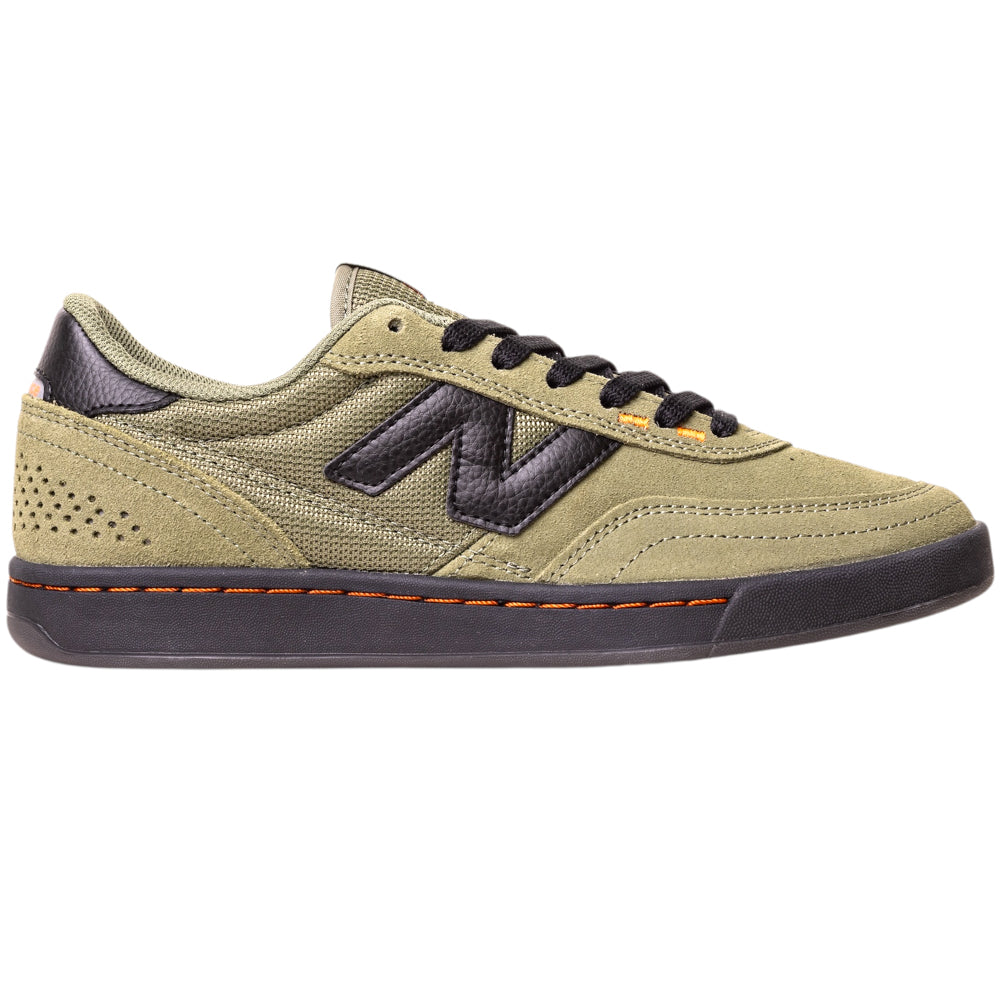 The 440NL2 Dark Olivine Black New Balance Numeric Suede Skateboarding Shoes feature an olive green suede upper with black accents, laces, and sole, an ABZORB midsole for comfort, N logo, and bold orange stitching along the sole.