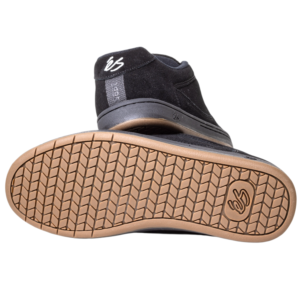 The Accel Black Noir Es Shoes Skateboarding Original Shape is shown with a gum cupsole and tread pattern, featuring the white és logo on the heel and sole, stitched accents, and a classic mid-top design inspired by the 1995 original.