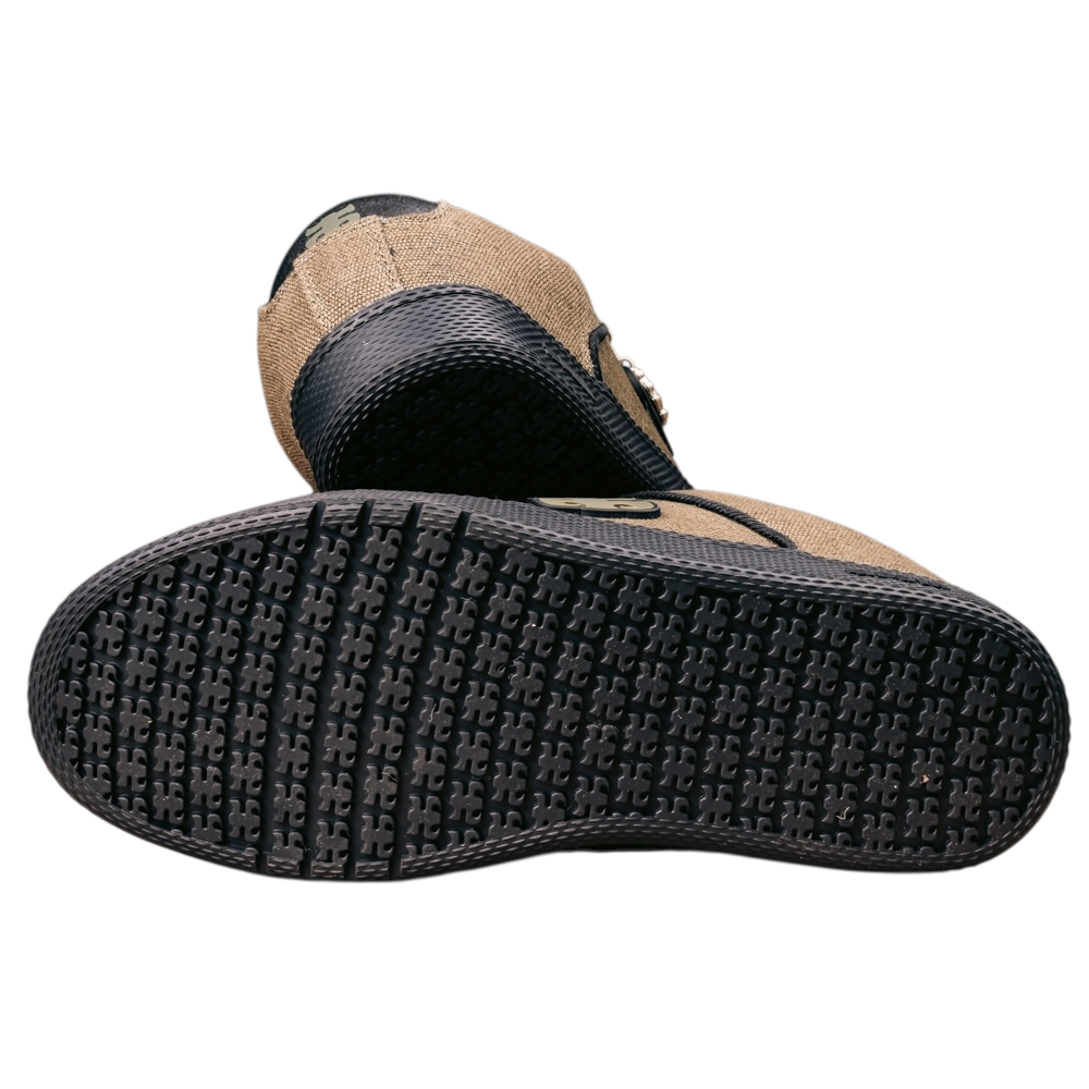 A close-up shows the Cricket Green Waxed Hemp I Path Shoes for skateboarding, featuring a textured black rubber sole with visible tread pattern and a tan waxed hemp upper accented with black trim and detailing.