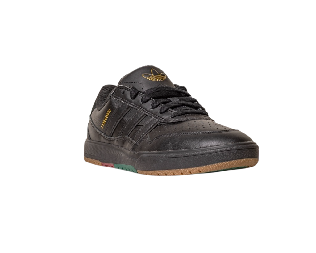 The Tyshawn 2 II Adidas Skateboarding Shoes in Core Black/Core Green feature premium leather, gold branding, a gum sole, and multicolored outsole details, shown angled on a white background.