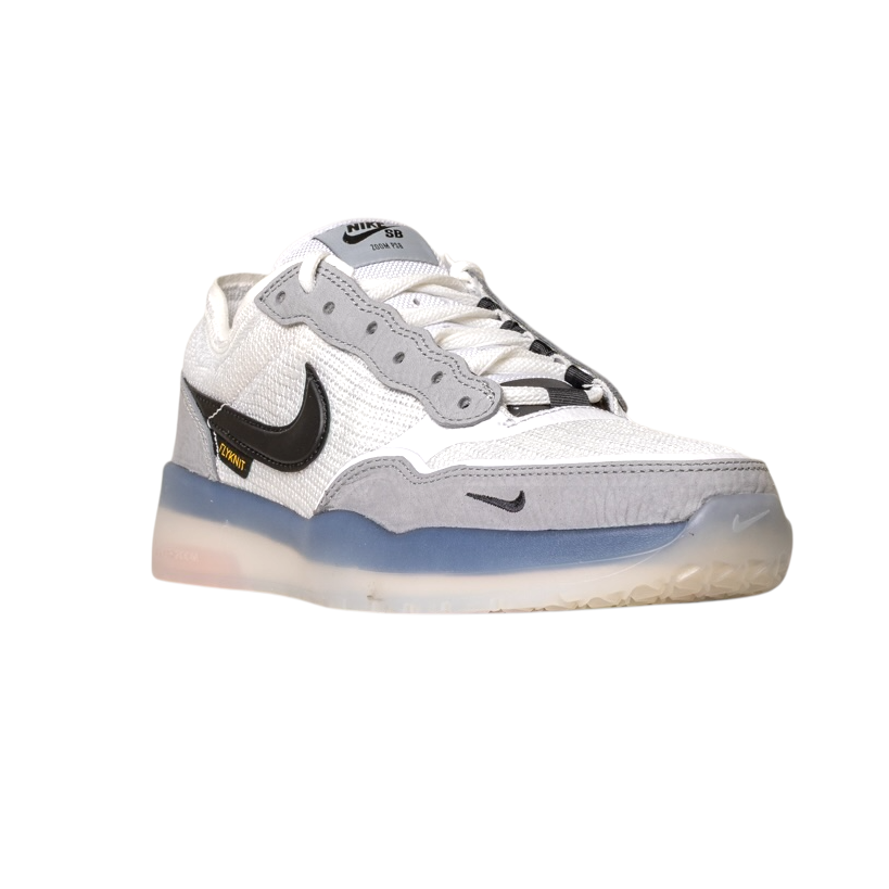 The FV8493004 Grey White PS8 Nike SB Leather Knit Shoes feature a white and gray design with a black swoosh, translucent sole, and signature Air Zoom cushioning, displayed on a plain white background.