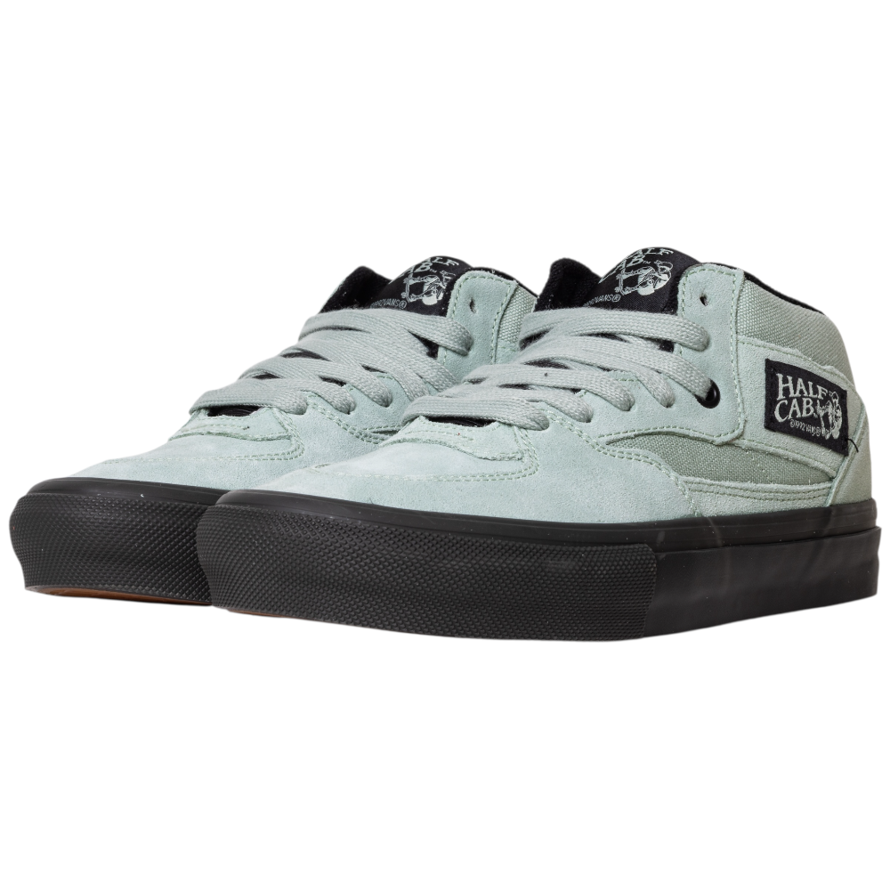 The VN0A5FCDEMW1 Gray Olive Suede Skate Half Cab Vans Shoes feature black laces, black soles, a black and white Half Cab side patch, and PopCush cushioning for enhanced comfort with every step.
